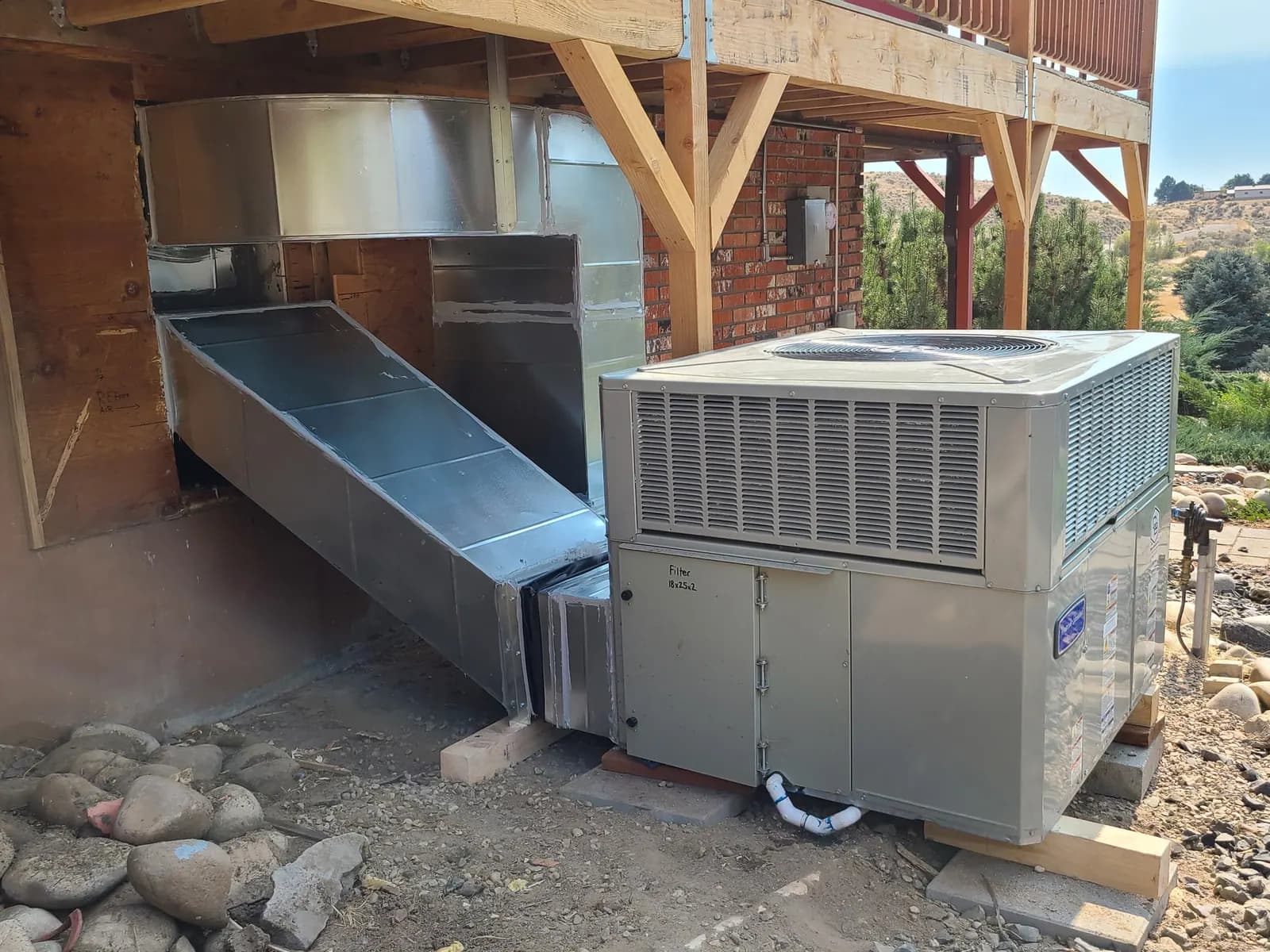 Outdoor HVAC equipment installed beside a home